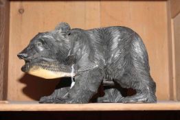 Carved wood bear with a fish,