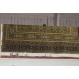 Bokhara carpet with a green ground 2.80 by 2.