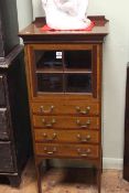 Edwardian mahogany and satinwood banded music cabinet having a glazed panel door above four drawers,