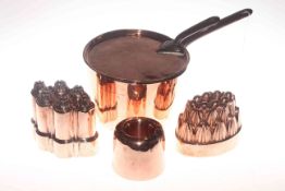 Three Victorian copper jelly moulds and Victorian lidded sauce pan