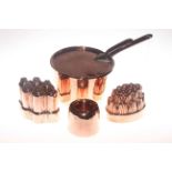 Three Victorian copper jelly moulds and Victorian lidded sauce pan