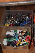 Box of action figures and box of model vehicles