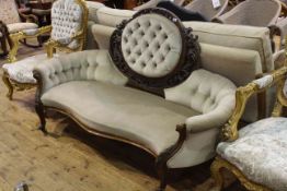 Victorian walnut framed settee having central oval panel back and serpentine front seat on cabriole