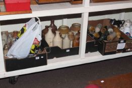 Three boxes of vintage stone and glass bottles, stoneware storage jars, badges,