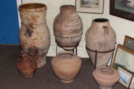 Collection of earthenware style garden pots and planters