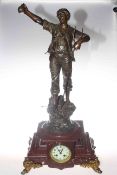 Mantel clock with gilded ornate feet, marble base and a spelter farmer figure,