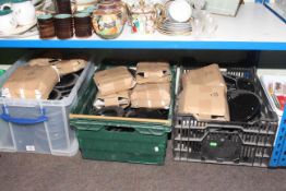 Three large boxes containing black glass oil lamp bases