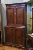 19th Century oak and mahogany four door press, the doors with inlaid oval panels,