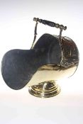 Ornate polished brass coal helmet,