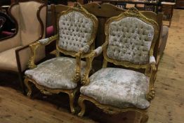 Pair ornate gilt open armchairs in buttoned plush fabric