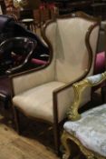 Edwardian mahogany and line inlaid wing back armchair in pink foliate pattern fabric