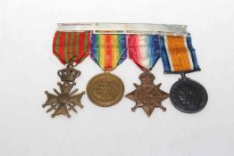 WWI group of four medals on bar with ribbons, photo of the soldier and a pay book.