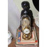 Two anniversary clocks, two dolls,