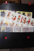 Uncut Artist Signed Bamforth postcards on sheets, Rowntree chocolate adverts,