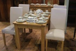 Light oak six piece dining suite comprising three door sideboard extending dining table and four