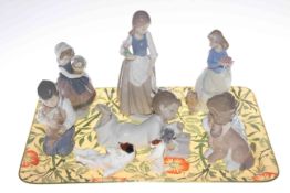 Lladro and five Nao figures and two Royal Doulton dogs