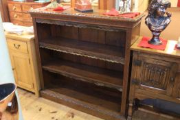 Victorian carved oak open bookcase with two adjustable shelves,