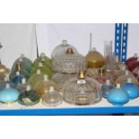 Collection of clear and coloured glass oil lamp reservoirs