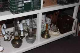 Two oil lamps, five branch light fitting, smokers cabinet, two carved wood camels,