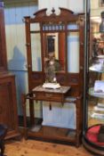 Victorian carved walnut and marble mirror backed hallstand,
