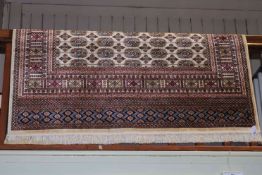 Bokhara carpet with a beige ground, 2.30 by 1.