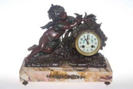 Bronze cherub clock 'Le Charmeur' on marble base with key