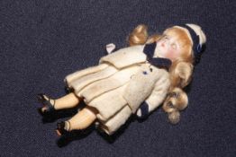 Bisque head doll with closing eyes,