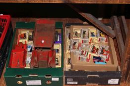 Two tinplate trucks and two boxes of Lledo model vehicles