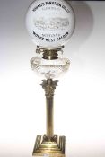 Brass and glass oil lamp with advert shade, Young's Paraffin Oil Co.
