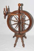 Walnut spinning wheel with turned spindles