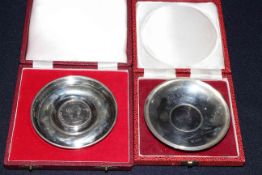 Two Churchill sterling silver commemorative Crown reversible dishes, in boxes, one with certificate,