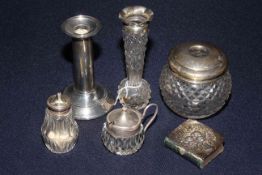 Six silver items including vase, pepperette, hair tidy, book,