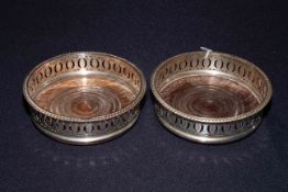 Pair of old Sheffield bottle coasters,