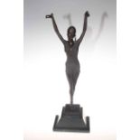 Bronze lady posed with outstretched arms on a marble plinth,