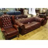 Ox blood buttoned leather four piece Chesterfield suite comprising three seater settee and chair,