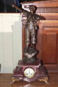 Spelter farmer figure mantel clock on marble base with gilded feet,