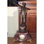 Spelter farmer figure mantel clock on marble base with gilded feet,