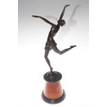 Bronze lady in dancing pose on a marble plinth,