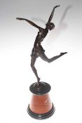 Bronze lady in dancing pose on a marble plinth,