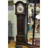 Early 20th Century carved oak triple weight longcase clock having arched brass and silvered dial