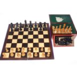 Two boxed chess sets,