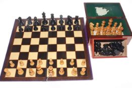 Two boxed chess sets,