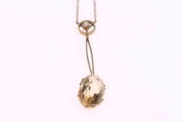 Gold chain with pearl drop and pale yellow stone pendant