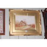 Framed watercolour of a farmyard cottage