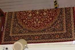 Keshan carpet with a red ground 2.30 by 1.