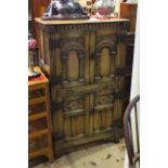 Carved oak four door cocktail cabinet,