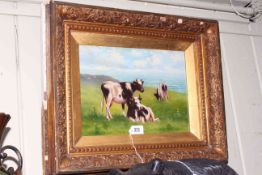 Gilt framed oil of Cows on Grassland by the Sea