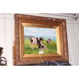 Gilt framed oil of Cows on Grassland by the Sea