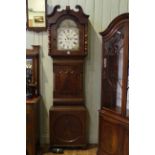 Antique mahogany eight day longcase clock having painted arched dial, signed J.G.