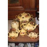 Collection of Aynsley Orchard Gold including soup tureen, teapots, two lidded boxes, storage jar,